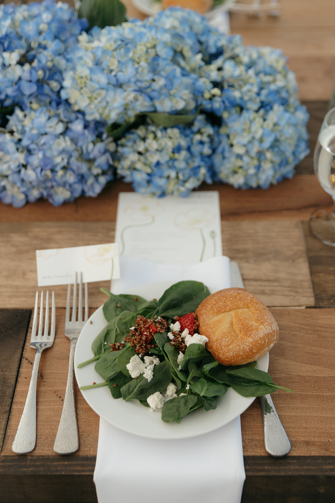 couple walking on beach wedding dress