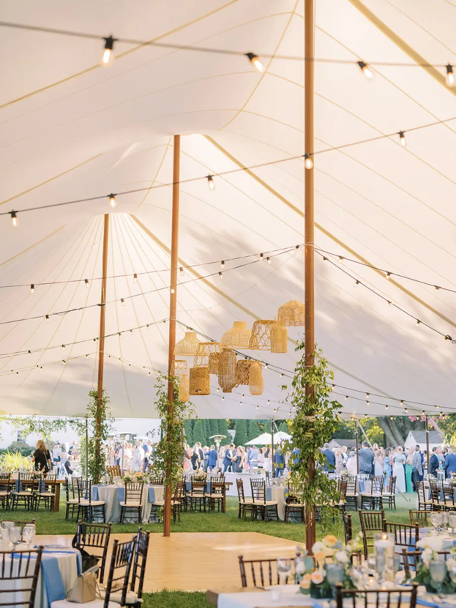 Interior of a sailcloth tent for a wedding in New Jersey with lanterns in the center of the tent