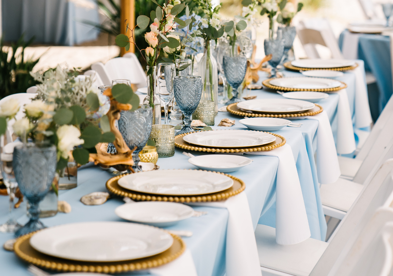 corporate_tabletop Tabletop items such as goblets, dinner plates, chargers on a blue linen
