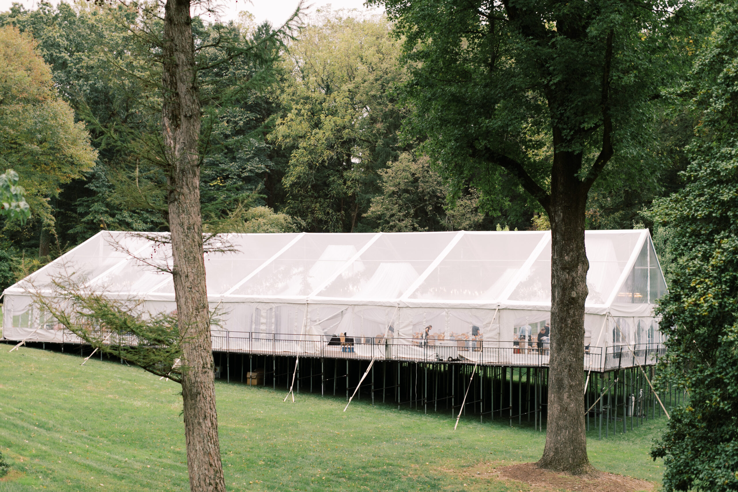 clear top tent installed on elevated leveled flooring on a hillside in Pennsylvania 