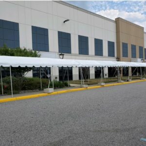 Marquee Tent set up on sidewalk in front of office building