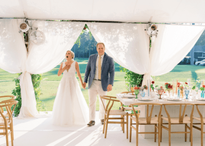 Couple entering sailcloth tent for the first time during their wedding