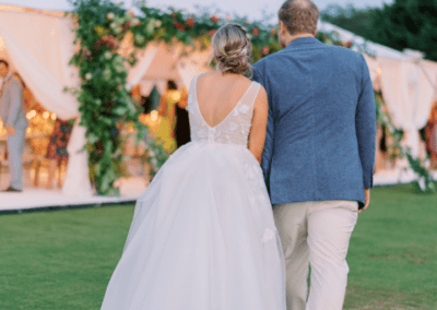 Couple walking up to Sailcloth Tent at Kings Creek Country Club