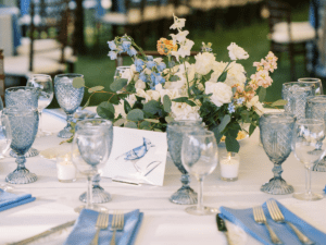 Table setting for a wedding under a sailcloth tent at Isaac Smith Vineyard