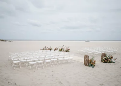 wedding chairs set up on beach