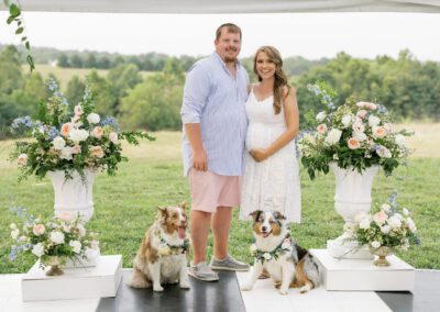 happy couple with dogs at baby shower