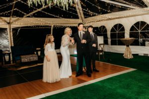 bride and groom speaking to guests