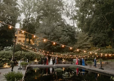 Lighting over reflecting pool by collective event group