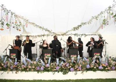 band stage with white wood surround