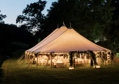 sailcloth tent in the evening with lighting glowing through tent top
