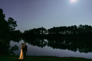 couple overlooking bay at dusk