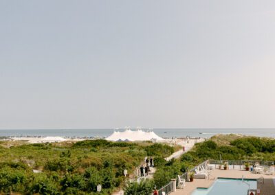drone view of wildwood new jersey shoreline with silhouette of white wedding tent