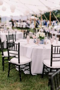 black chiavari chairs around tables with white linen