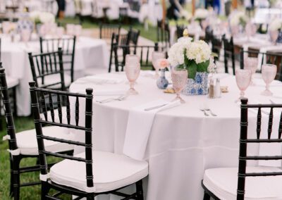black chiavari chairs around tables with white linen