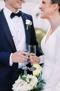 bride and groom toasting with champagne flutes
