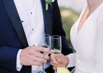 bride and groom toasting with champagne flutes