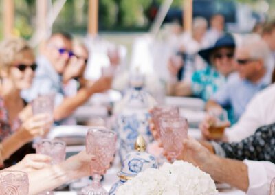 wedding guests toasting with pink glassware
