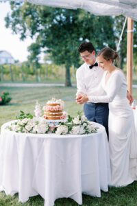 bride and groom cutting cake