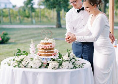 bride and groom cutting cake