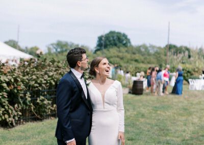 bride and groom gazing at the blue sky