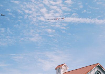 wedding sign airplane fly by on summer day