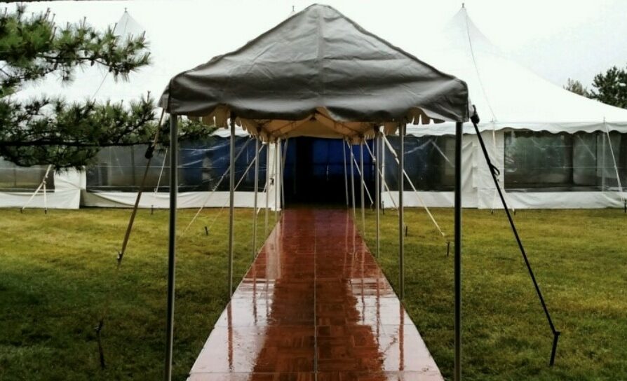 Marquee entrance into tent_sea colony marquee tent with wood floor leading into event tent