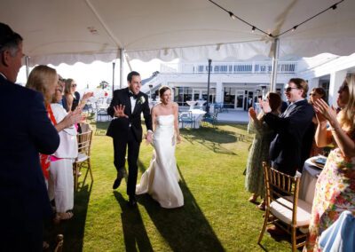bride and groom entering reception tent in rehoboth beach delaware