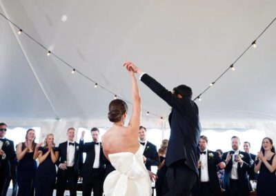 bride and groom under tent
