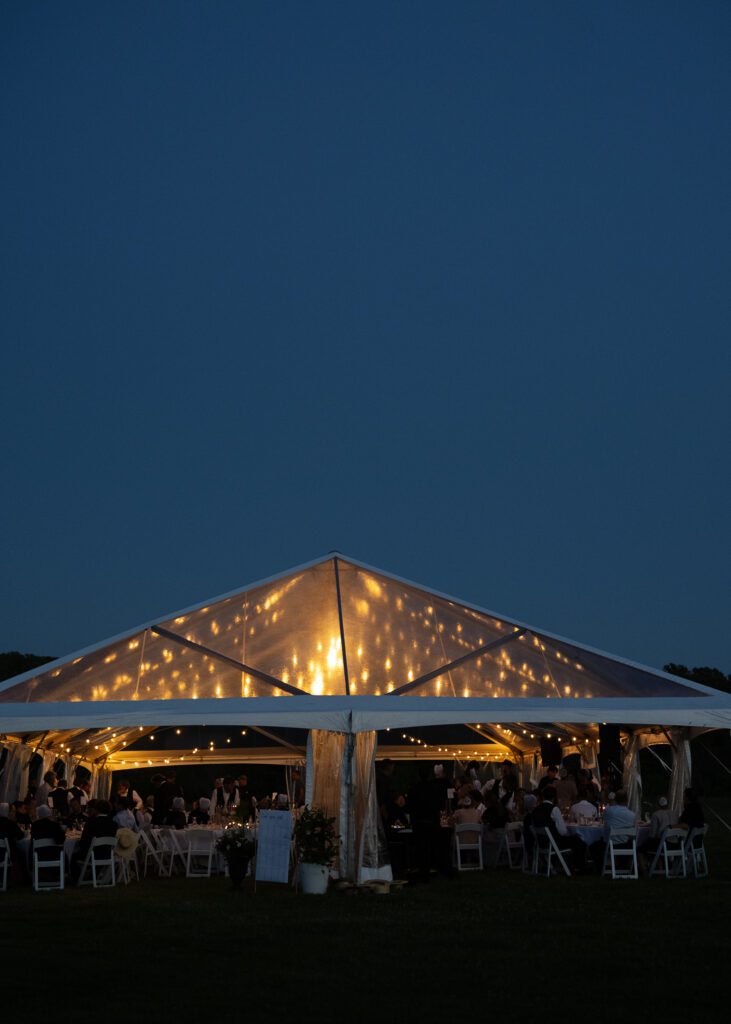 clear top frame tent with lighting glowing through tent top