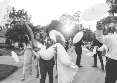 Groom carrying bride during recessional