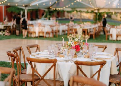 clear tent set up with garland draped from ceiling