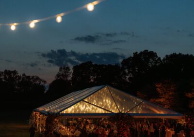 clear top frame tent with lights glowing thru