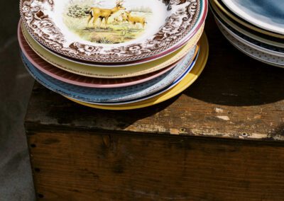 vintage plates stacked on table