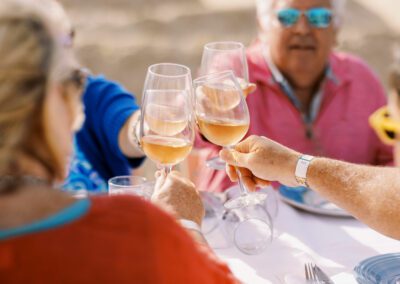 group of friends celebrating with wine