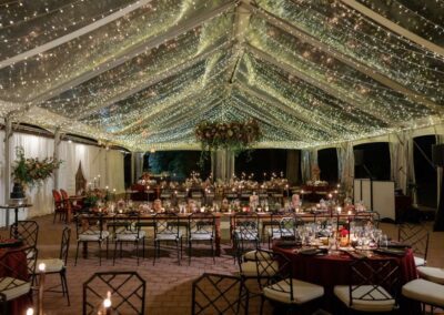 clear top wedding tent with waterfall lighting and floral chandelier