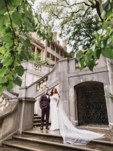 bride and groom posing at winterthur steps