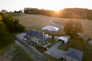 sunset over field with trees in background
