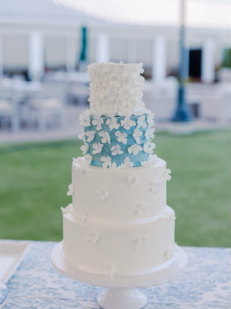 white and blue floral wedding cake