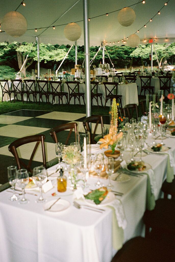 photo of wedding reception under high peak pole tent