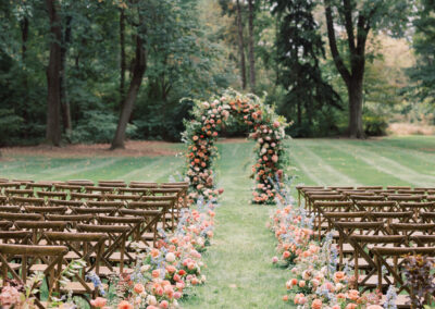 cross-back chairs set up in rows for outdoor wedding ceremony