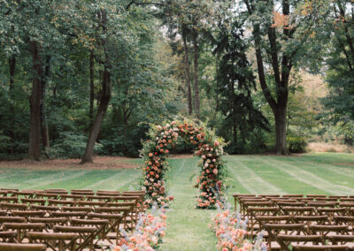 cross-back chairs set up in rows for outdoor wedding ceremony
