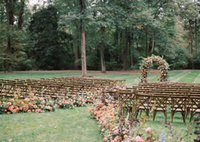 cross-back chairs set up in rows for outdoor wedding ceremony