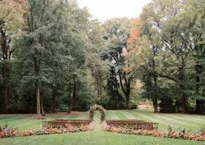cross-back chairs set up in rows for outdoor wedding ceremony