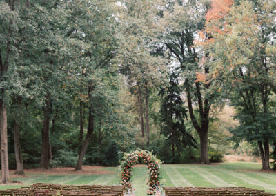 cross-back chairs set up in rows for outdoor wedding ceremony