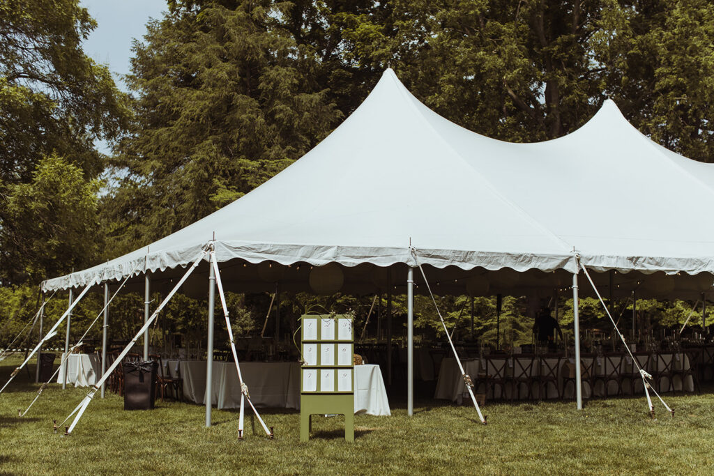 high peak pole tent set on green lawn