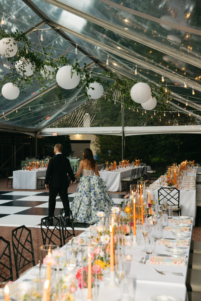 clear top tent with greenery and paper lanterns