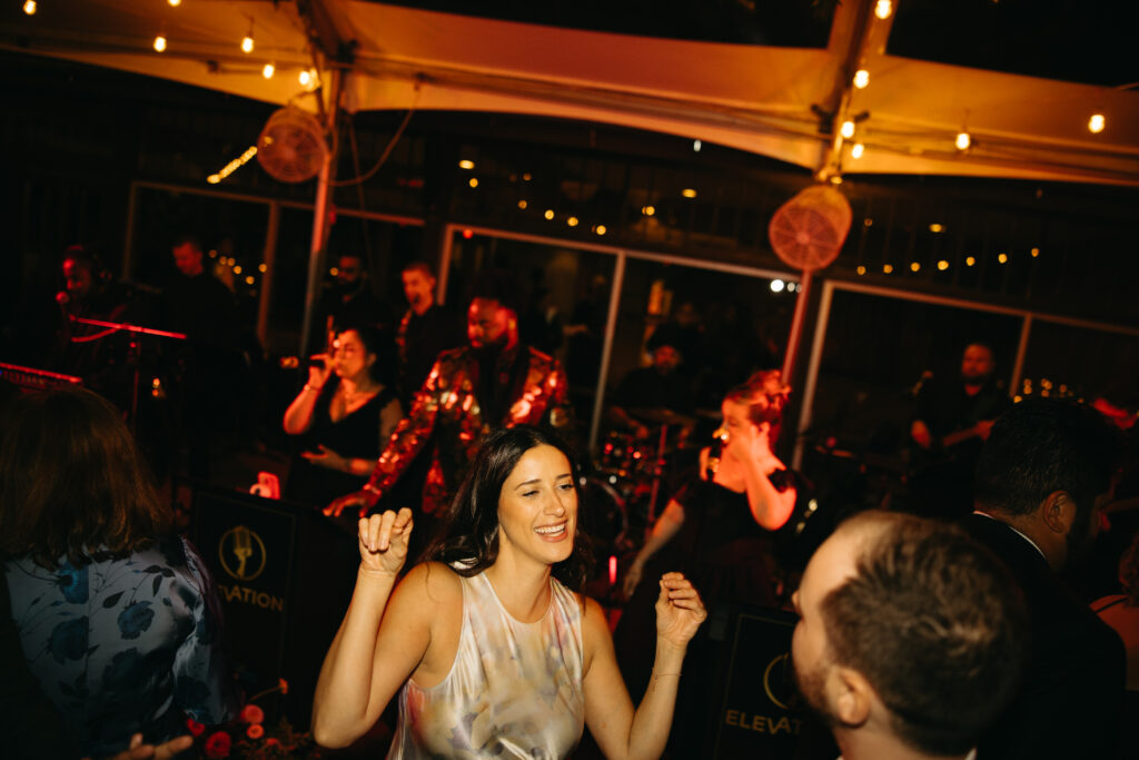 people dancing under tent
