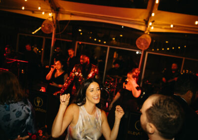 people dancing under tent