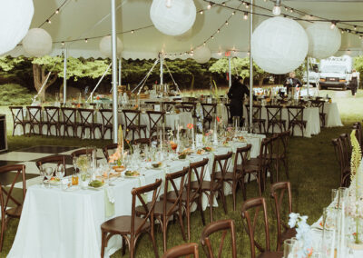 photo of wedding reception under high peak pole tent