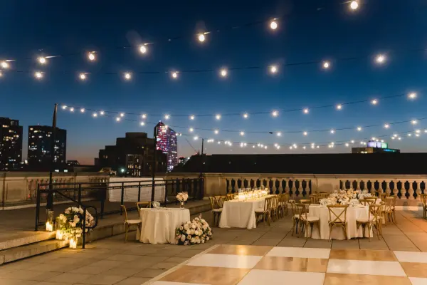 White & Birch checkered dance floor on a rooftop reception by Collective Event Group